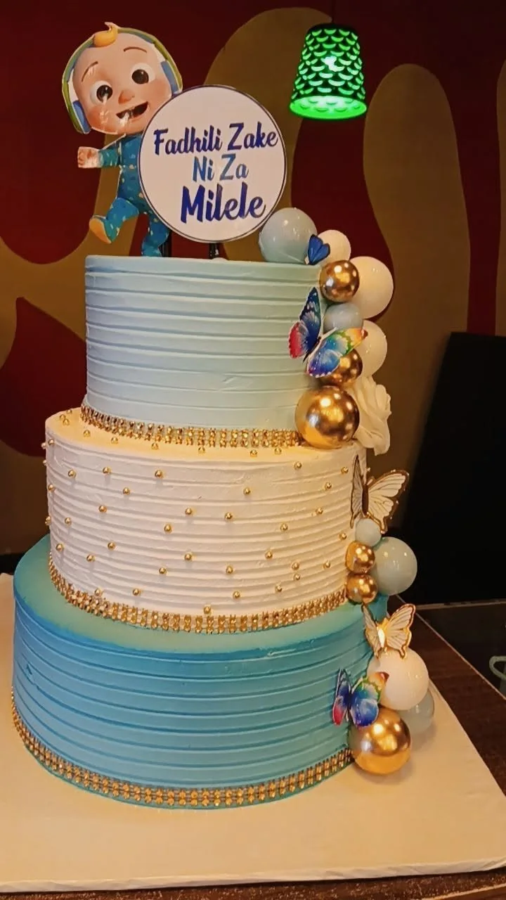 Baby boy tiered celebration cake by Stark’s Cake House in Turkana
