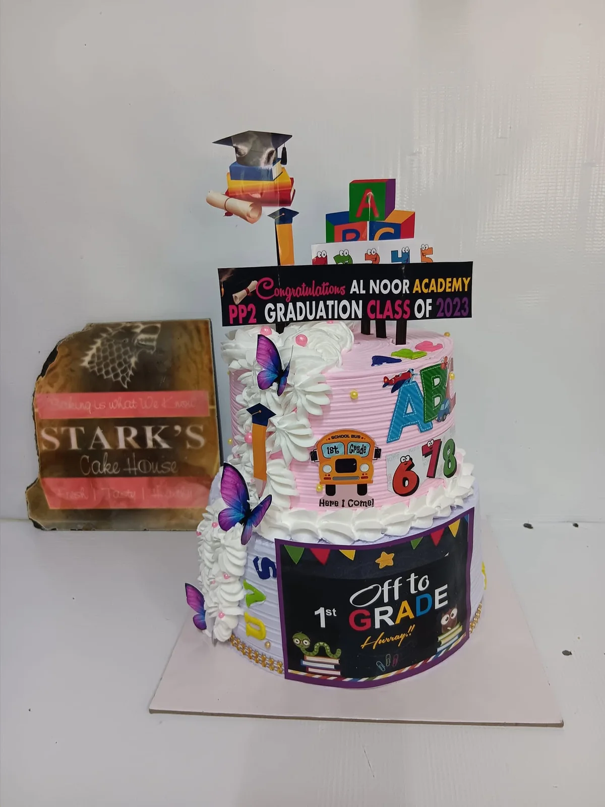 Tiered school graduation cake by Stark’s Cake House in Turkana
