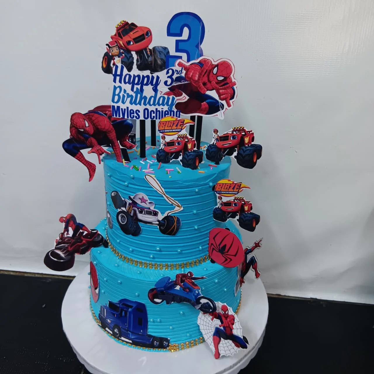 Spiderman themed tiered cake by Stark’s Cake House in Turkana