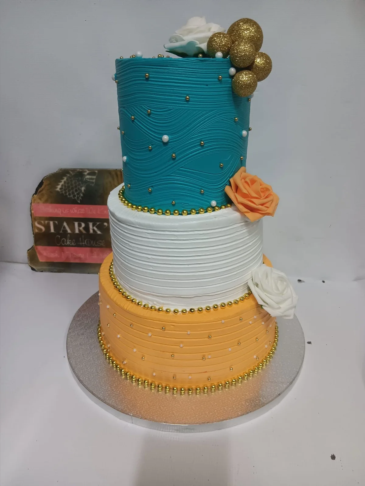 Elegant tiered celebration cake by Stark’s Cake House in Turkana